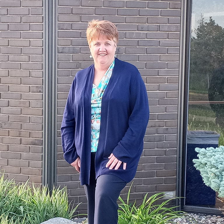 Behind every transaction is a team: Karen Powell ensures business debit and ATM reliability for community banks
